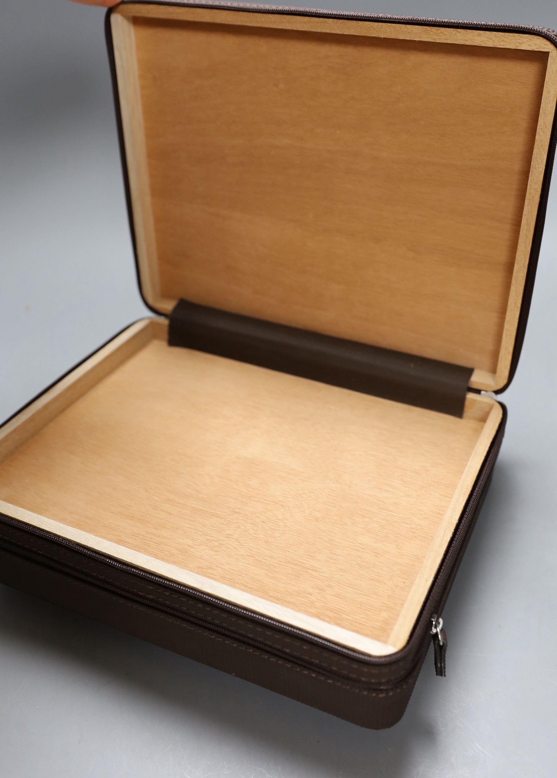 A Montecristo cigar humidor and another faux walnut humidor